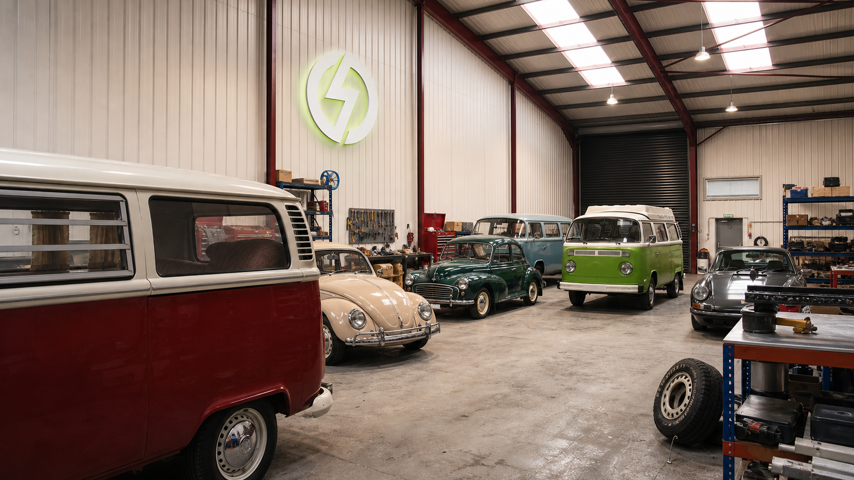 Classic electric conversion vehicles in an eDub-style workshop